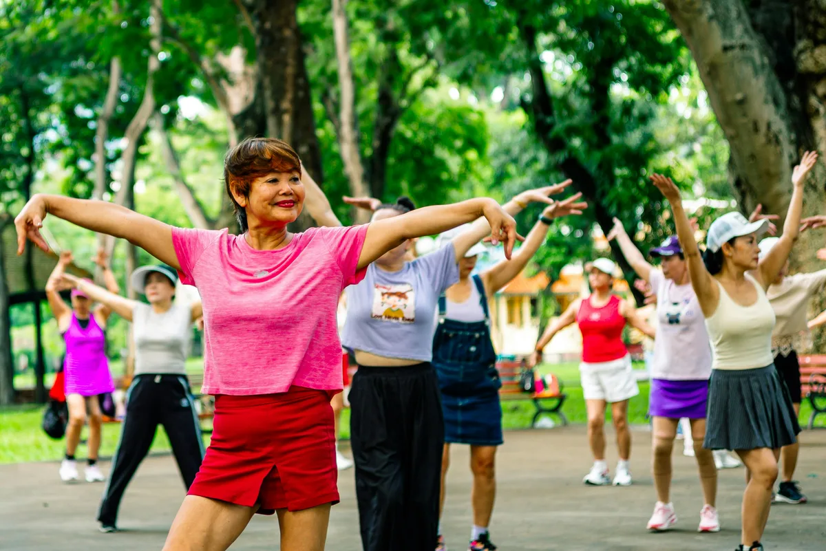Older adults exercising together outdoors — sarcopenia prevention through strength and mobility